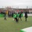 Children playing soccer in a Multiarena enclosed sports field.