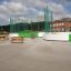 Outdoor sports field with green fencing, part of Multiarena.