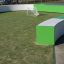 Outdoor football field with green and white barriers, featuring a small goal - Multiarena.