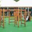 Chimpanzee wooden climbing frame with slide on playground surface