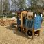 Tractor with trailer playground equipment.