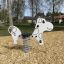 Spring rocker in the shape of a cow for playgrounds