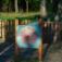 Outdoor wooden play clock for children in a park.