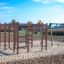 Activity Center wooden playhouse on a sandy playground