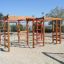 Activity Center wooden playhouse with climbing frames and ladders in playground