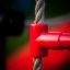 Red climbing rope connector of Activity Center wooden playhouse.