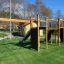 Spiderman jungle gym with climbing net and slides in a playground