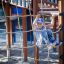 Child climbing on wooden play structure with slide from Explorer castle.
