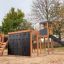 Outdoor Explorer castle with slide playground structure.