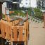 Smart Modern Nature wooden playhouse with slide in a playground setting