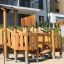 Rubik Modern Nature wooden playhouse with slide, outdoor playground structure.