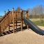 Wooden play structure with slide - Kiosk Modern Nature wooden playhouse.