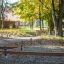 Outdoor balance beams in a park setting.