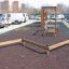 Wooden playground obstacle course Balance in an outdoor parking area.