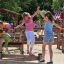 Children balancing on the Balance playground equipment.