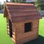 Wooden Nature Playhouse on artificial grass.