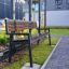 Outdoor Oxford Bench in a modern garden setting.