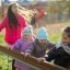 Children playing on the Chain Bridge at a playground.