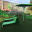 Green Lounge Sofa in an outdoor playground setting.