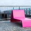 Lounge Sofa in vibrant pink color on a terrace.