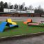 Colorful Lounge Sofa chairs on grass in urban outdoor area