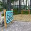 Outdoor playground equipment Somersault Single in a forest setting.