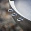 Stainless steel grill with hooks.