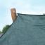 Sun Shade Triangle 5x5x5 Nature (Robinia) attached to a wooden post.