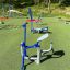 Outdoor exercise equipment Rider on playground with rubberized surface.