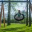 Bird Nest Swing with Tower (BNS 90 cm) playhouse with slide in a garden setting