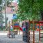 Children playing on a Bird Nest Swing with Tower (BNS 90 cm) playhouse with slide in a playground.